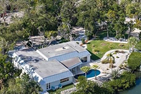 5155 Hidden Harbor Road Sarasota, FL 34242 - Photo 8 of 56 an aerial view of a house with swimming pool and garden view