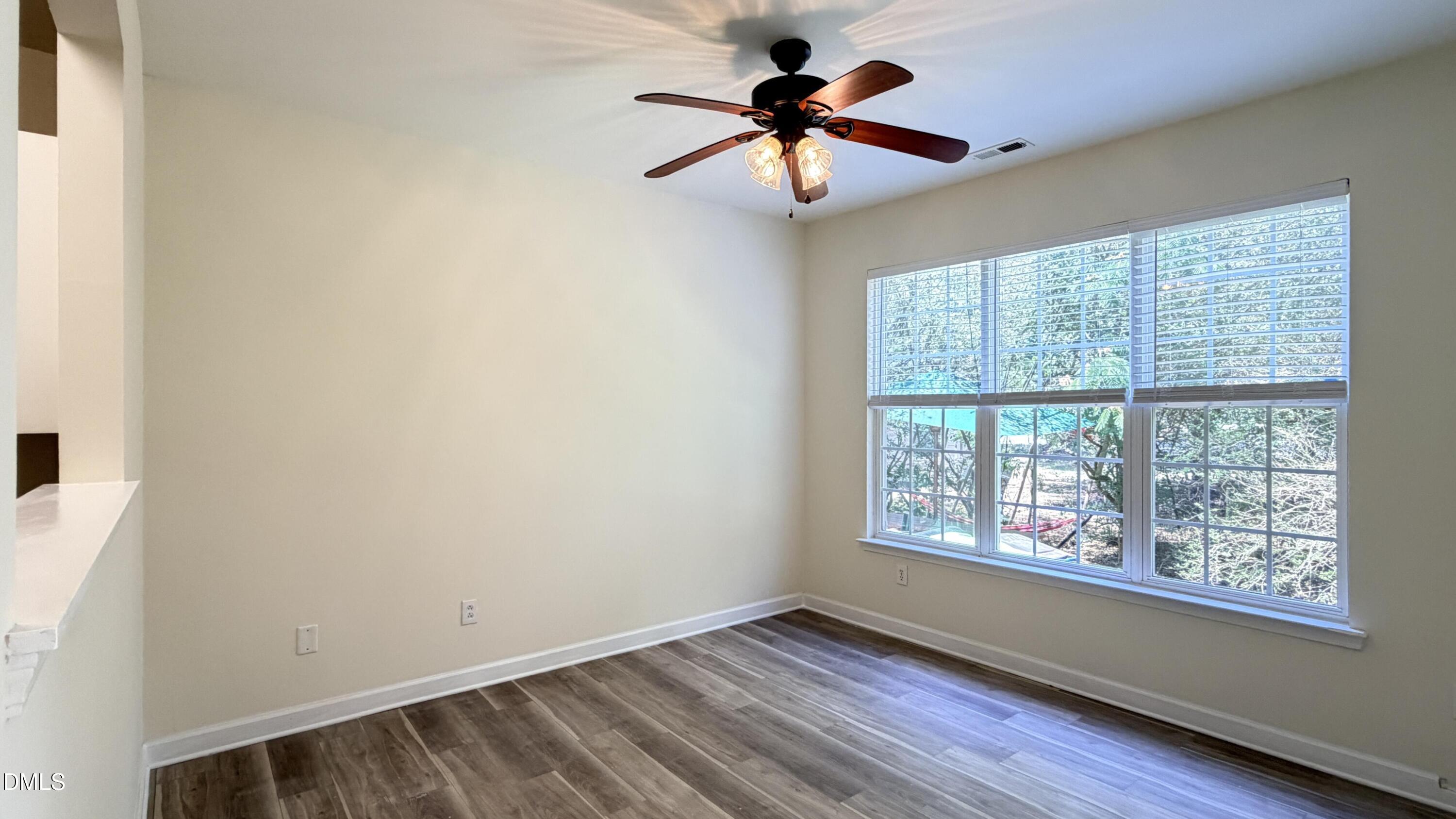 4123 Standing Rock Way Raleigh, NC 27604 - Photo 9 of 29 wooden floor in an empty room with a window