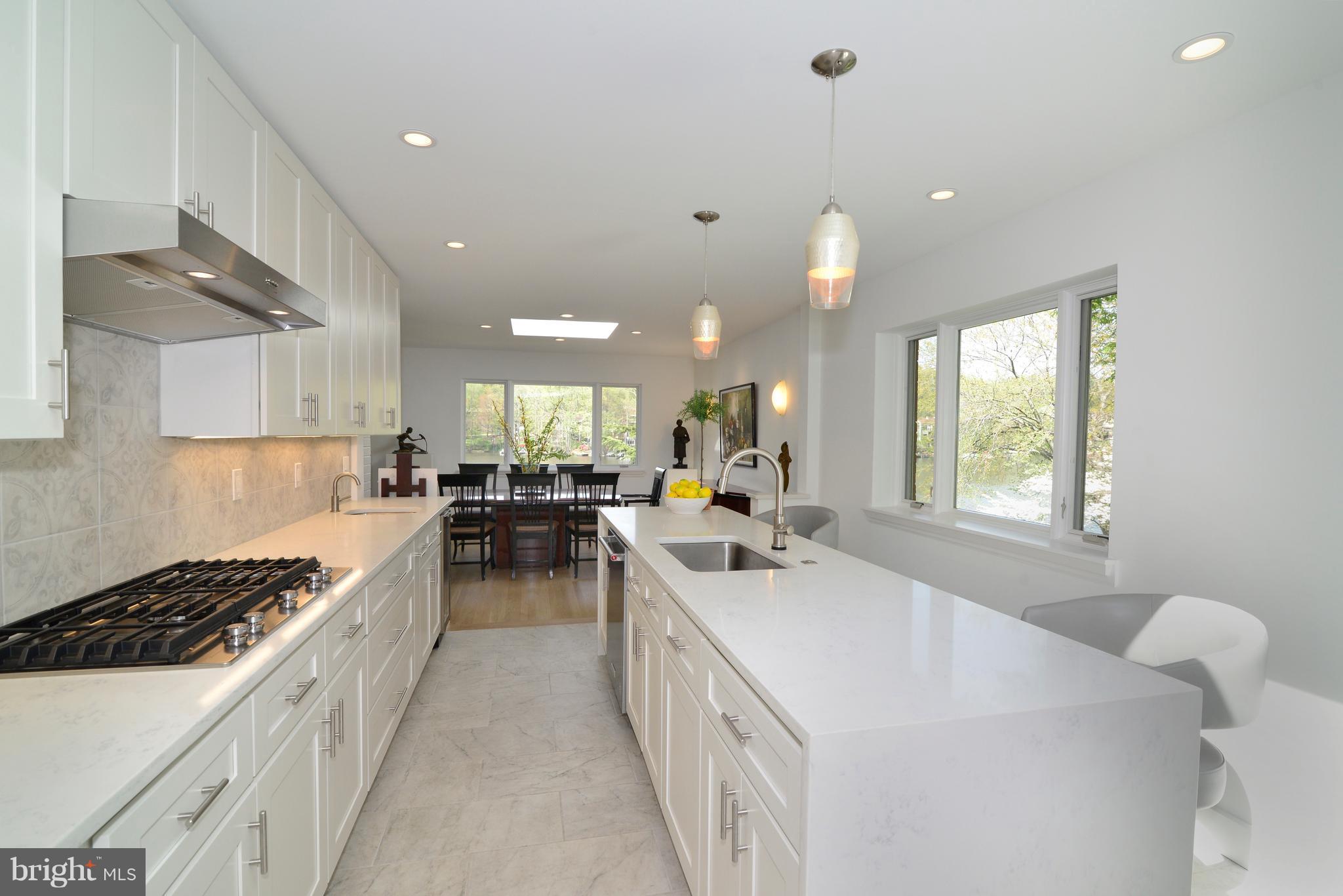 11316 South Shore Road Reston, VA 20190 - Photo 11 of 29 a kitchen with counter top space appliances and a window