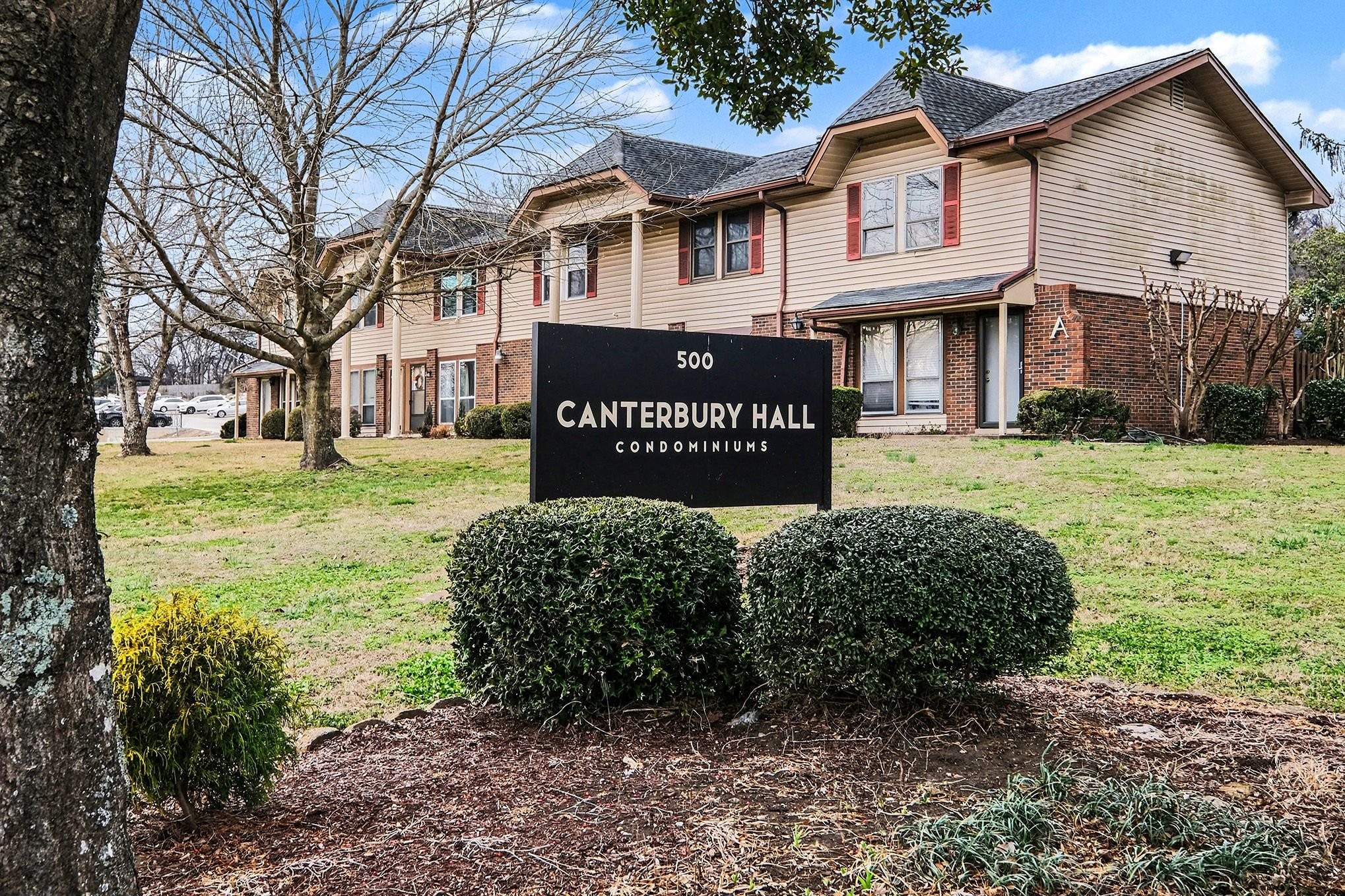 500 Paragon Mills Road, Unit N15 Nashville, TN 37211 - Photo 9 of 11 a view of a house with a yard and garage