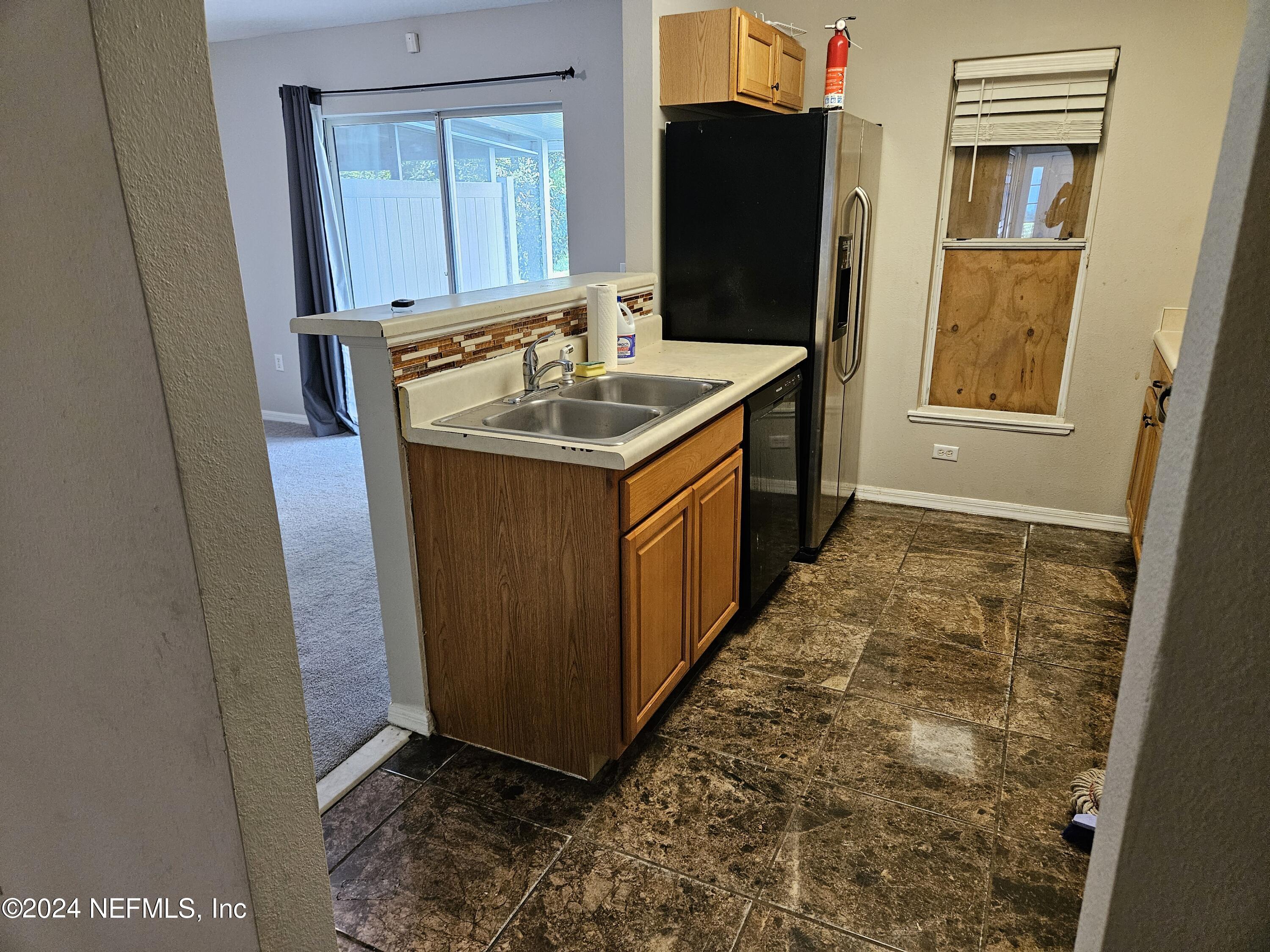 711 Talking Tree Drive Jacksonville, FL 32205 - Photo 16 of 61 a bathroom with sink and mirror