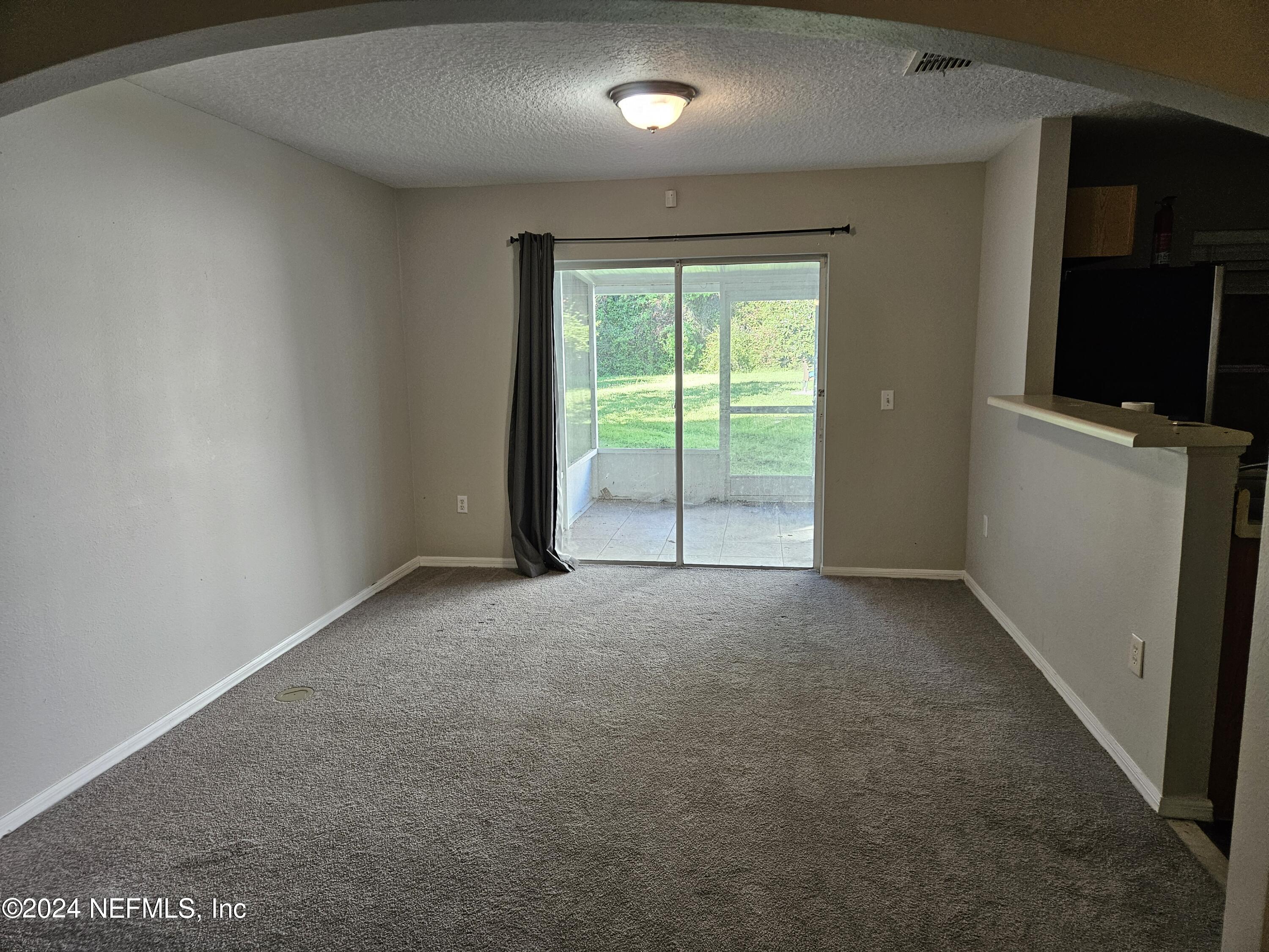 711 Talking Tree Drive Jacksonville, FL 32205 - Photo 20 of 61 a view of an empty room with a window