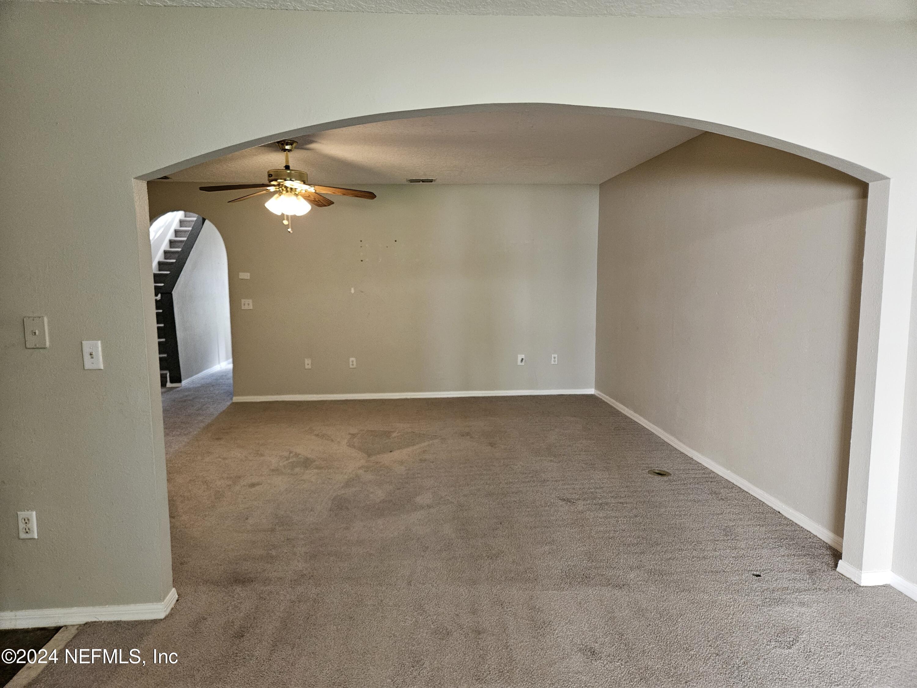 711 Talking Tree Drive Jacksonville, FL 32205 - Photo 21 of 61 an empty room with windows and entrance