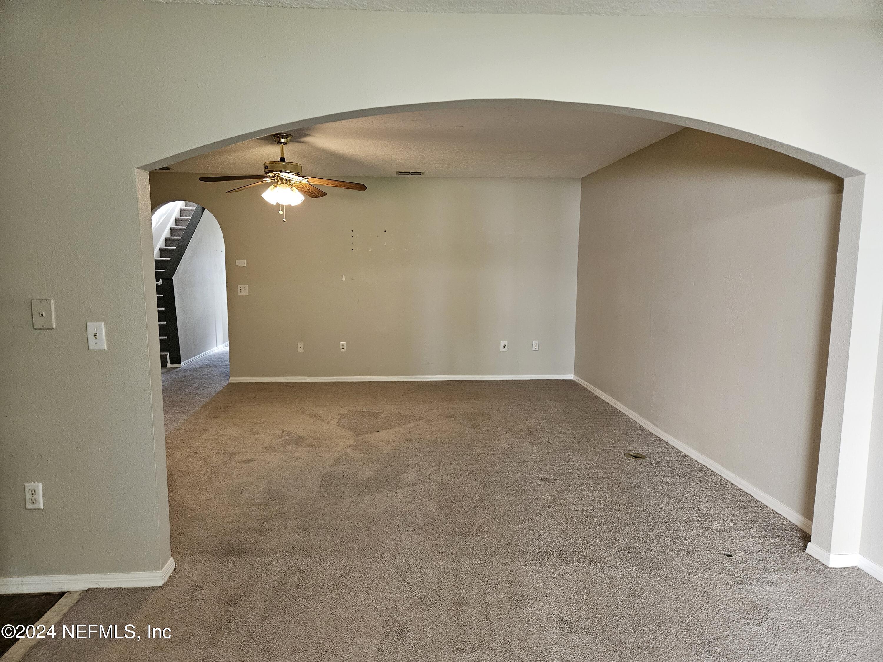 711 Talking Tree Drive Jacksonville, FL 32205 - Photo 22 of 61 an empty room with windows and entrance