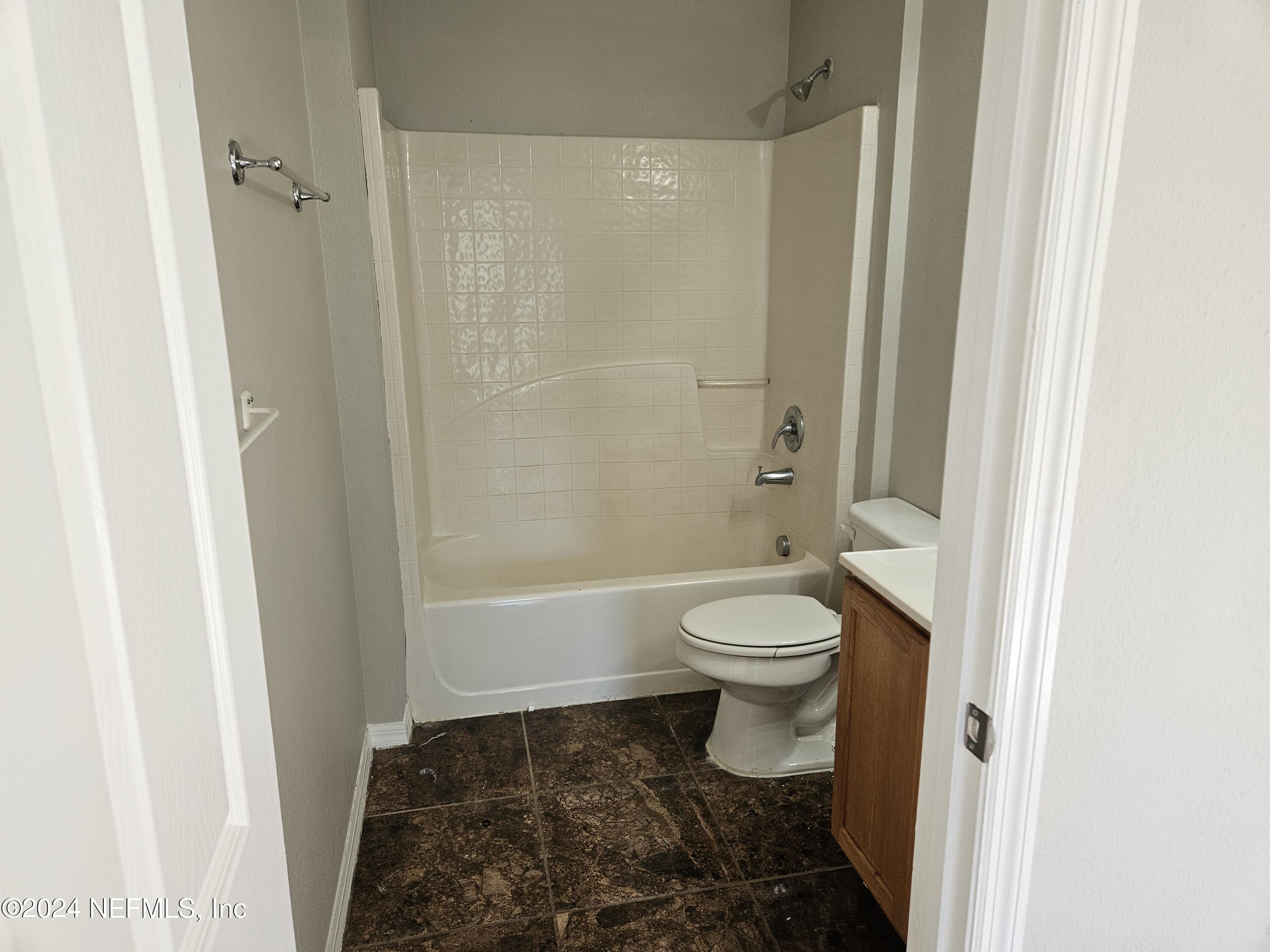 711 Talking Tree Drive Jacksonville, FL 32205 - Photo 33 of 61 a bathroom with a toilet and a shower