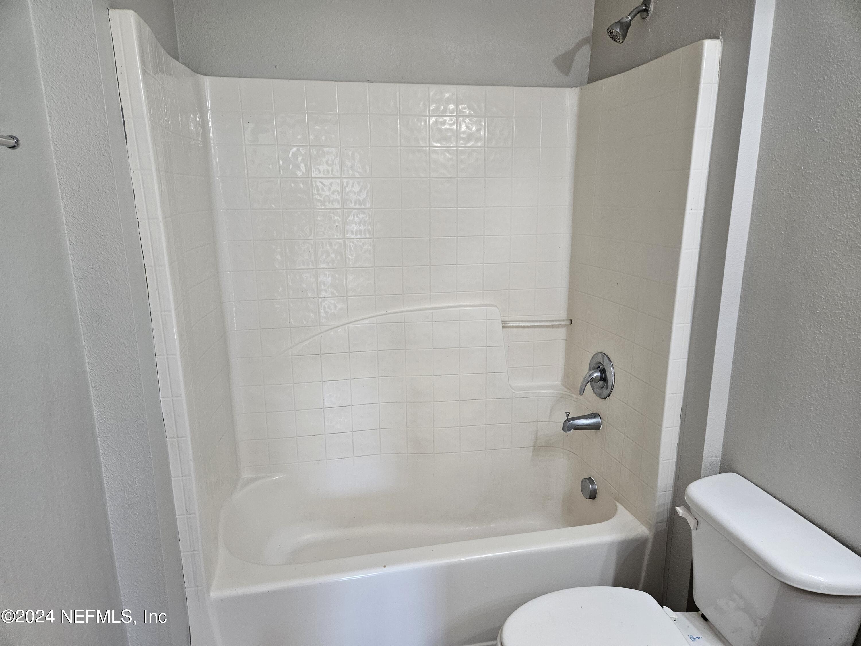 711 Talking Tree Drive Jacksonville, FL 32205 - Photo 35 of 61 a bathroom with a shower and a toilet