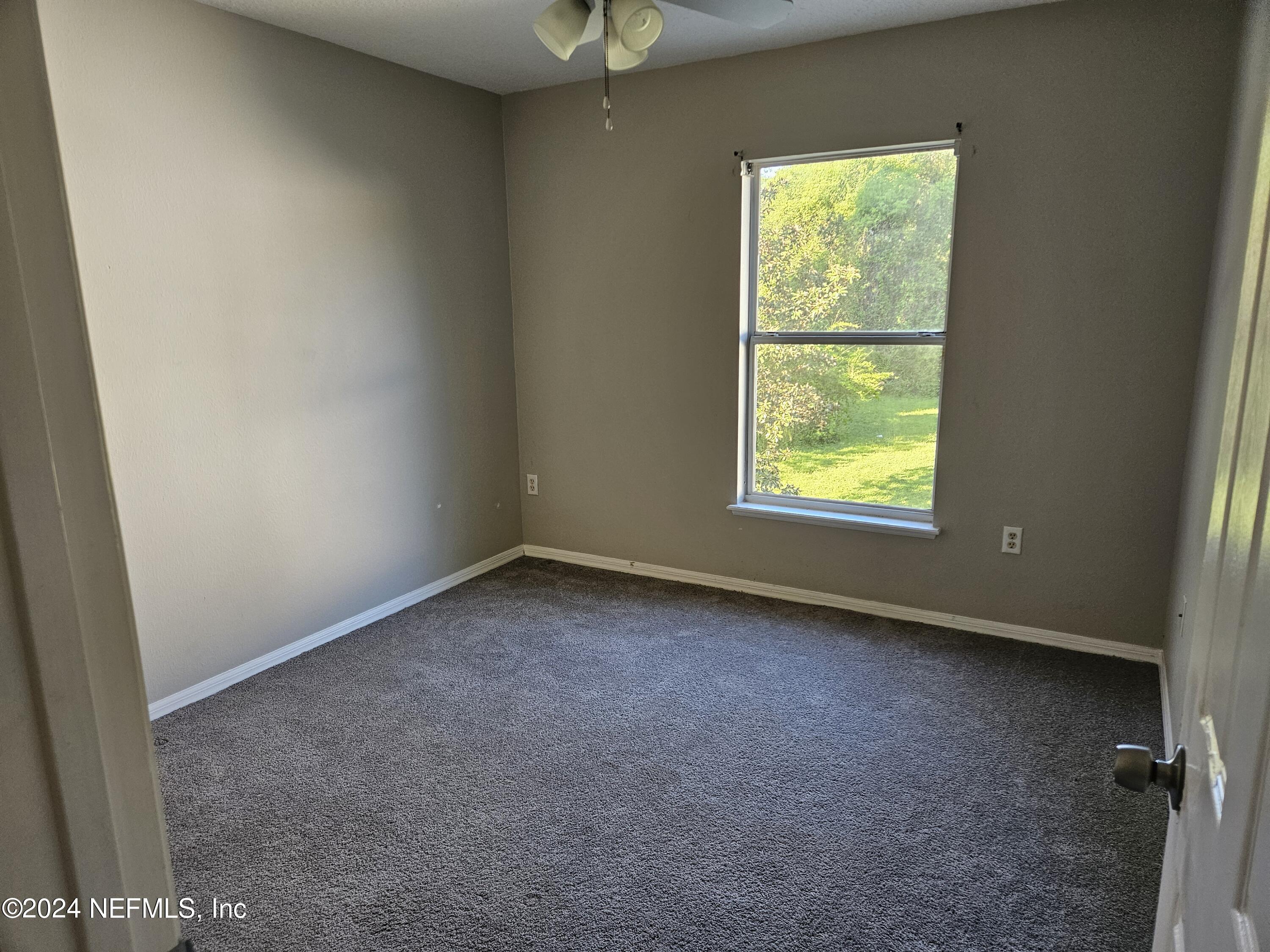711 Talking Tree Drive Jacksonville, FL 32205 - Photo 49 of 61 an empty room with a window