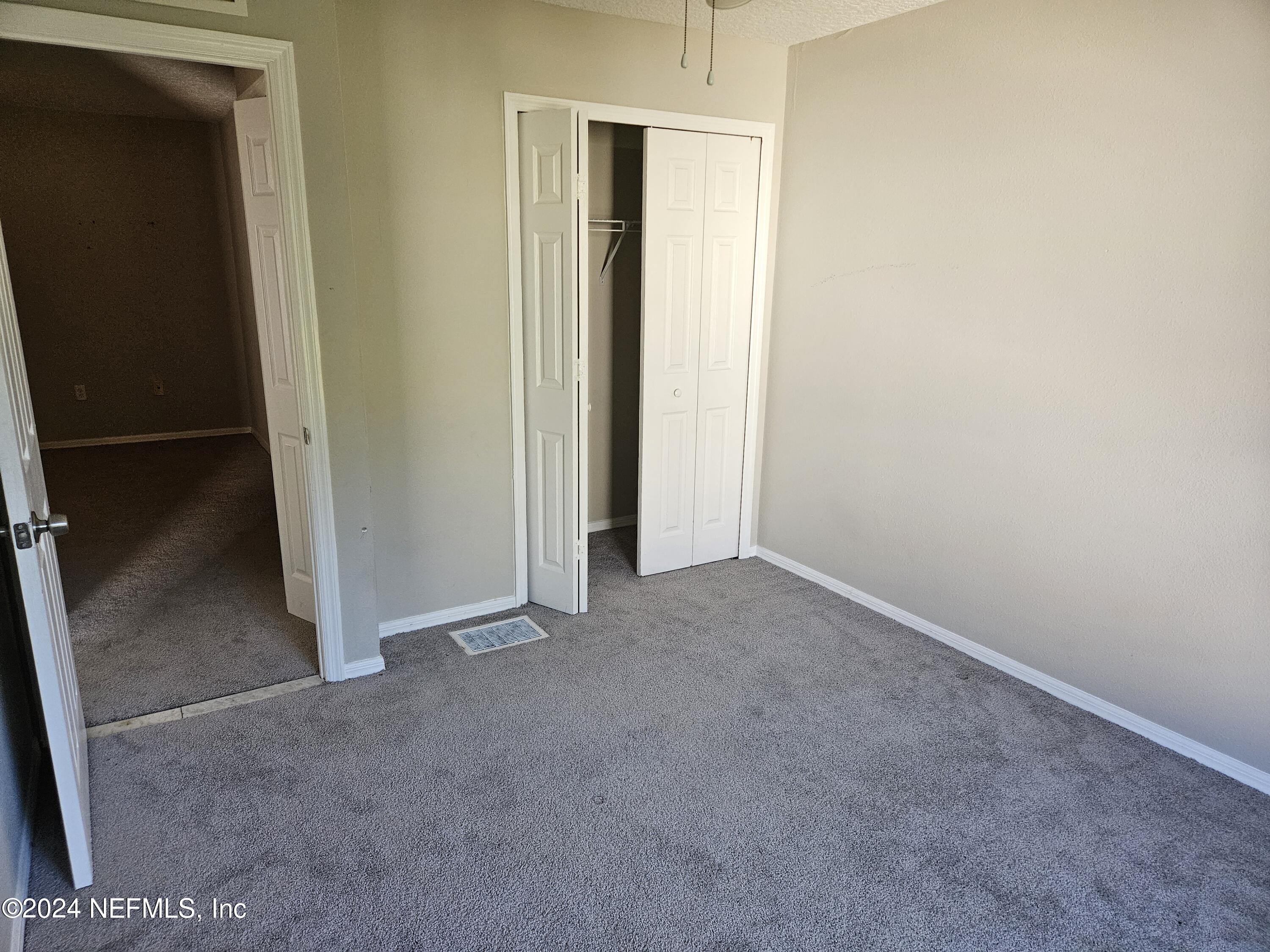 711 Talking Tree Drive Jacksonville, FL 32205 - Photo 50 of 61 an empty room with closet