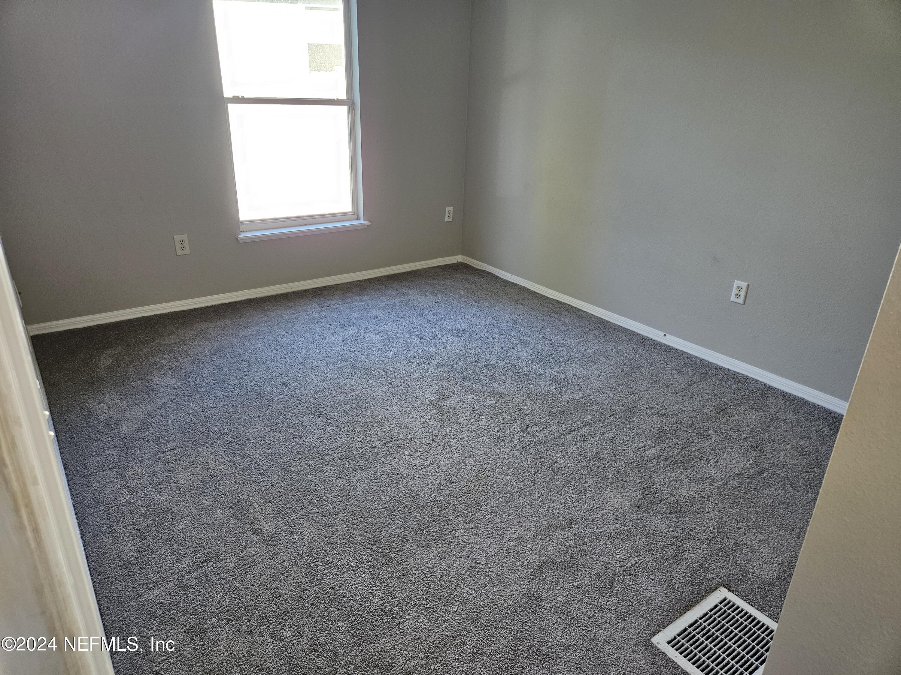 711 Talking Tree Drive Jacksonville, FL 32205 - Photo 51 of 61 an empty room with a window