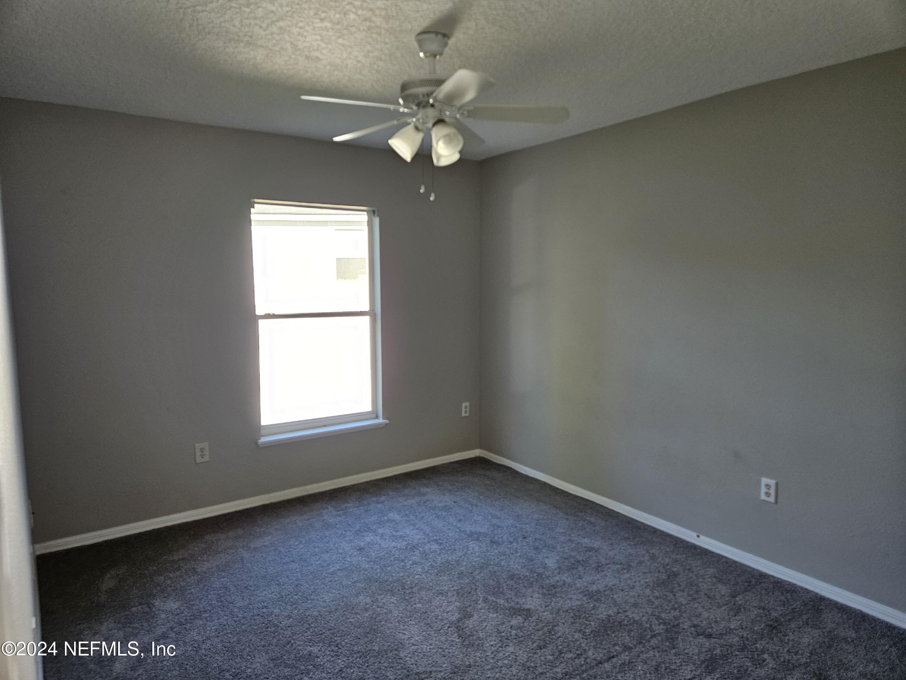 711 Talking Tree Drive Jacksonville, FL 32205 - Photo 52 of 61 an empty room with a window