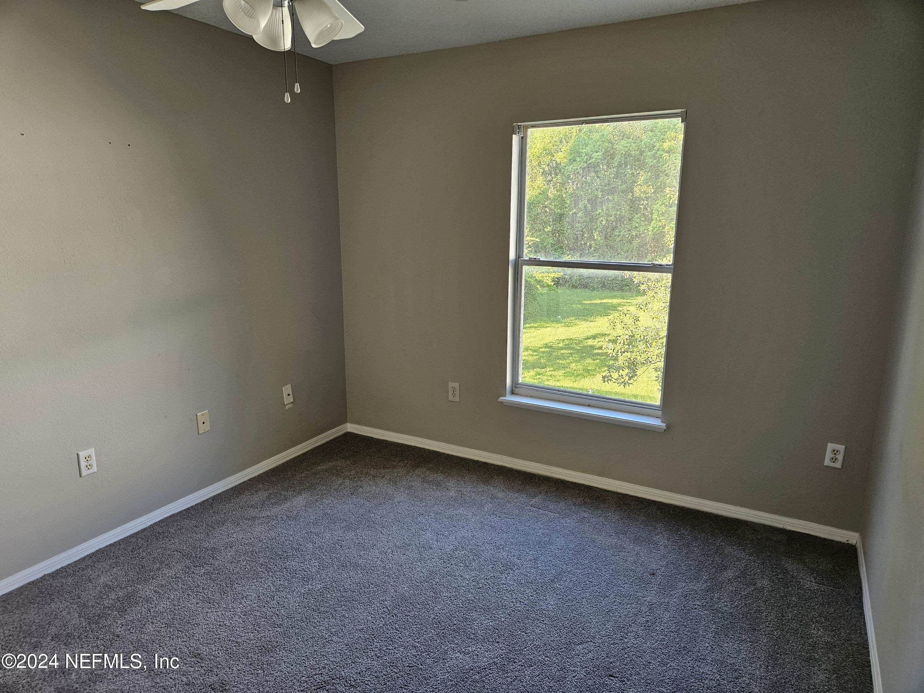 711 Talking Tree Drive Jacksonville, FL 32205 - Photo 54 of 61 a view of an empty room with a window