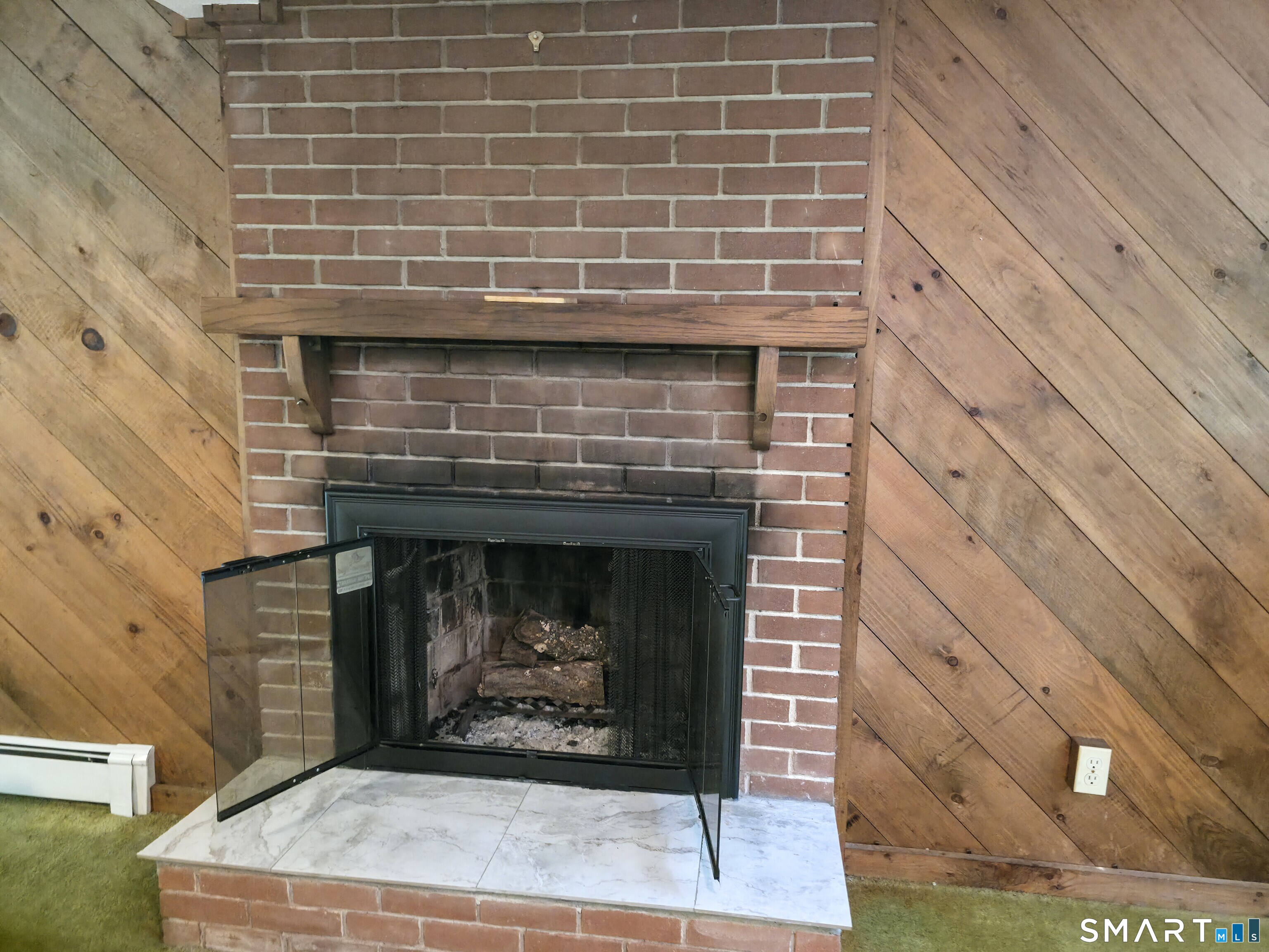 279 Gales Ferry Road Groton, CT 06340 - Photo 26 of 32 Lower level wood burning fireplace