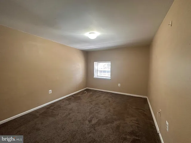 an empty room with a empty space and window