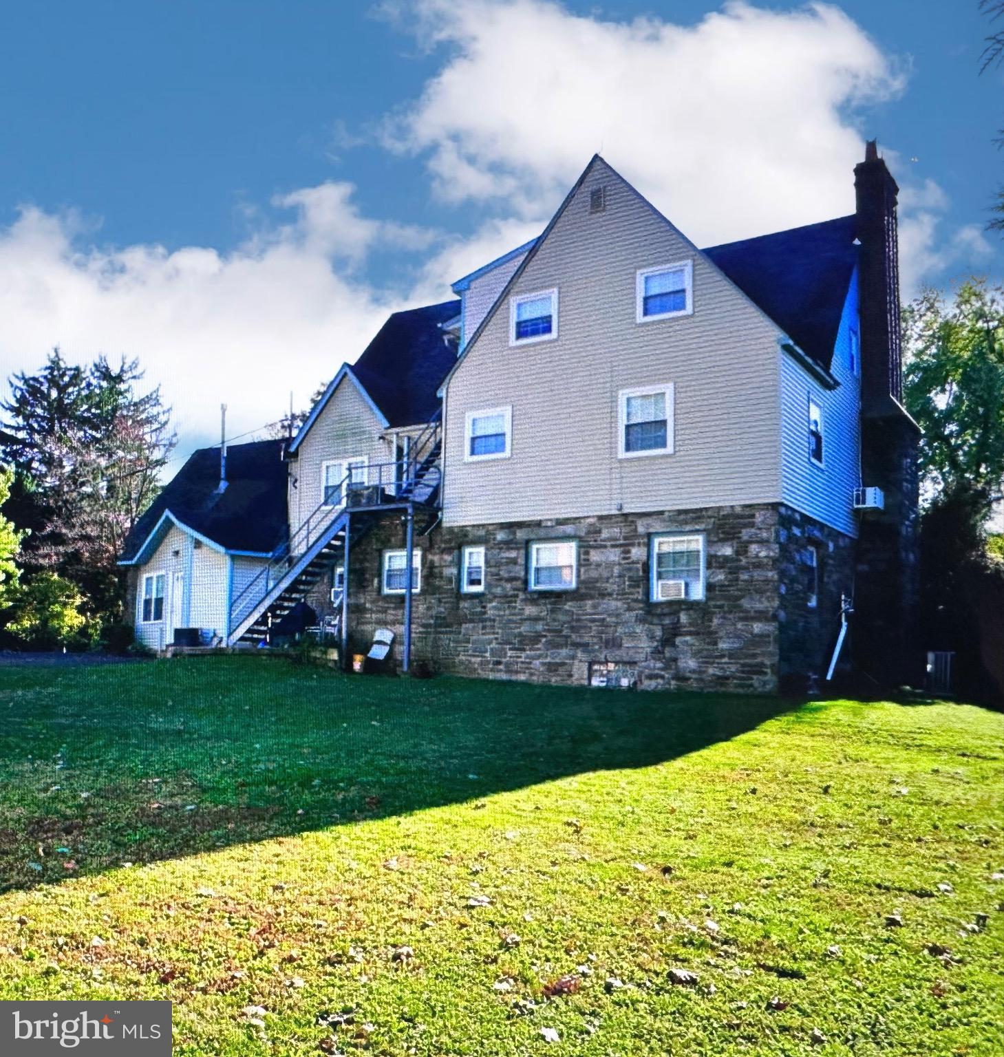 2250 Boyd Road, Unit A Huntingdon Valley, PA 19006 - Photo 2 of 18 a front view of a house with a yard