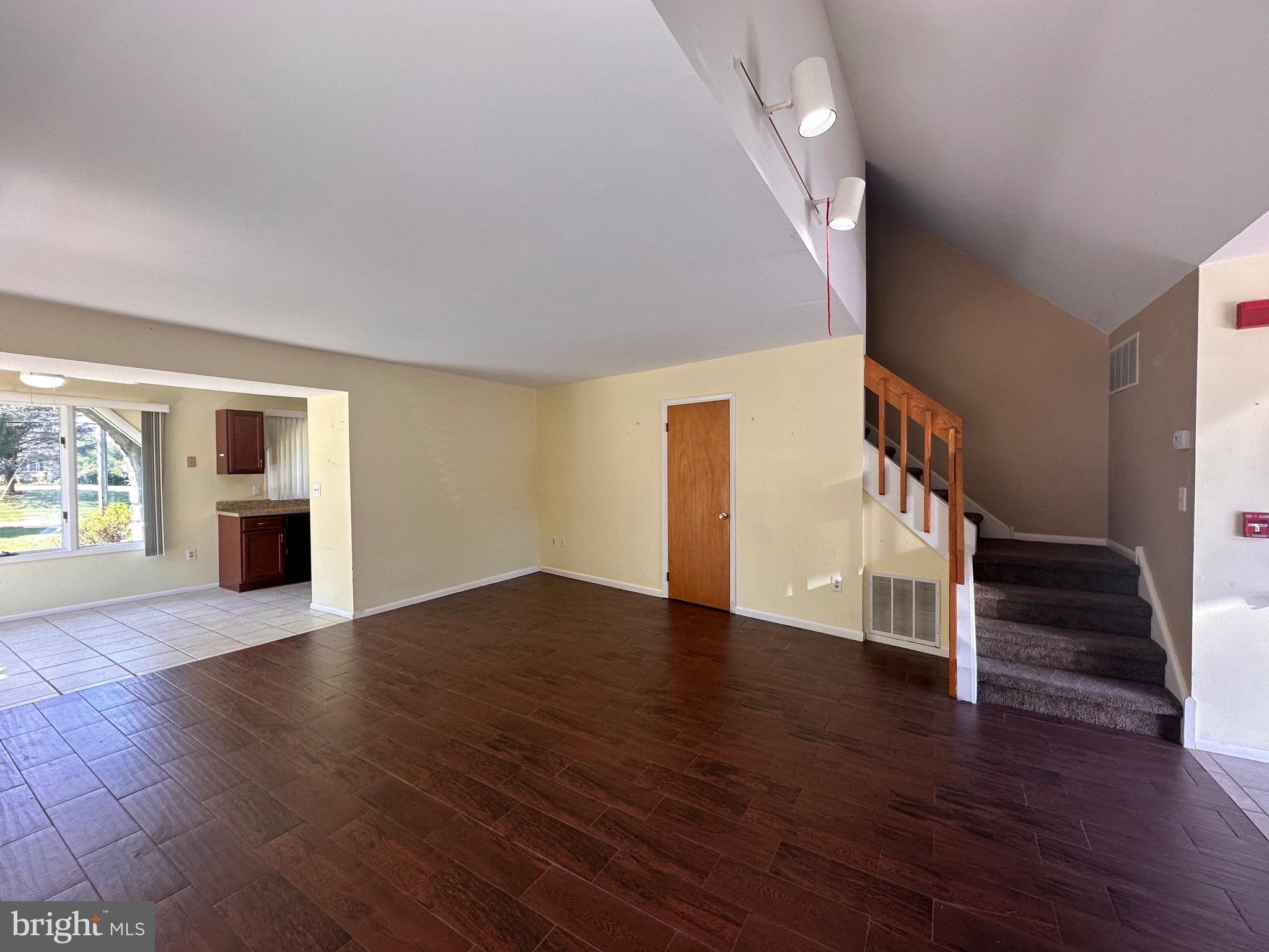 2250 Boyd Road, Unit A Huntingdon Valley, PA 19006 - Photo 5 of 18 a view of empty room with wooden floor and kitchen view