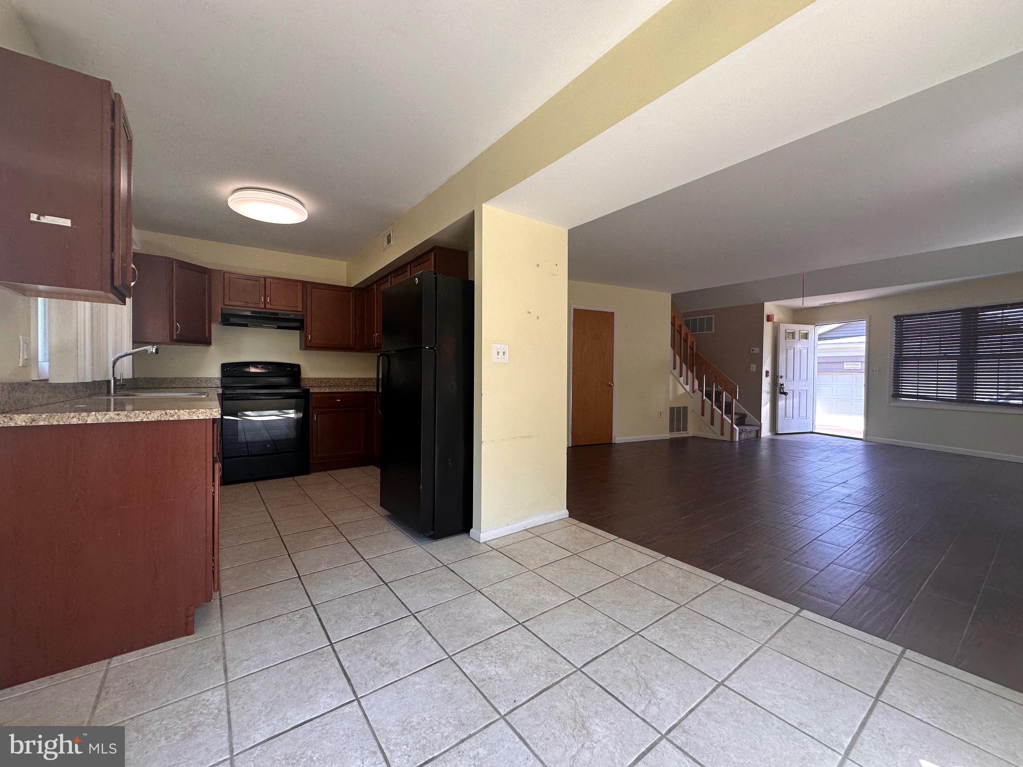 2250 Boyd Road, Unit A Huntingdon Valley, PA 19006 - Photo 10 of 18 a kitchen with stainless steel appliances granite countertop a refrigerator and a sink