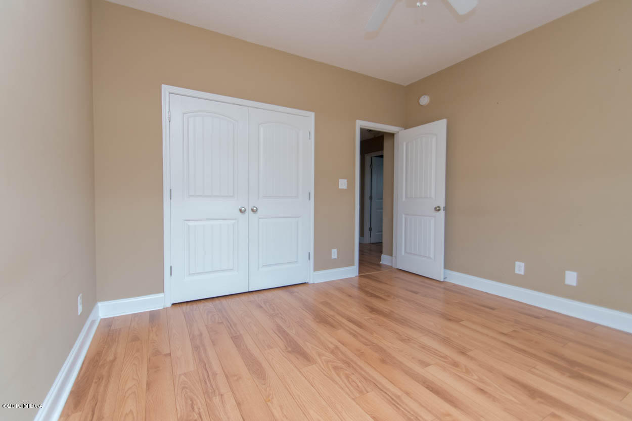 2725 Moseley Road Byron, GA 31008 - Photo 18 of 34 a view of an empty room with wooden floor