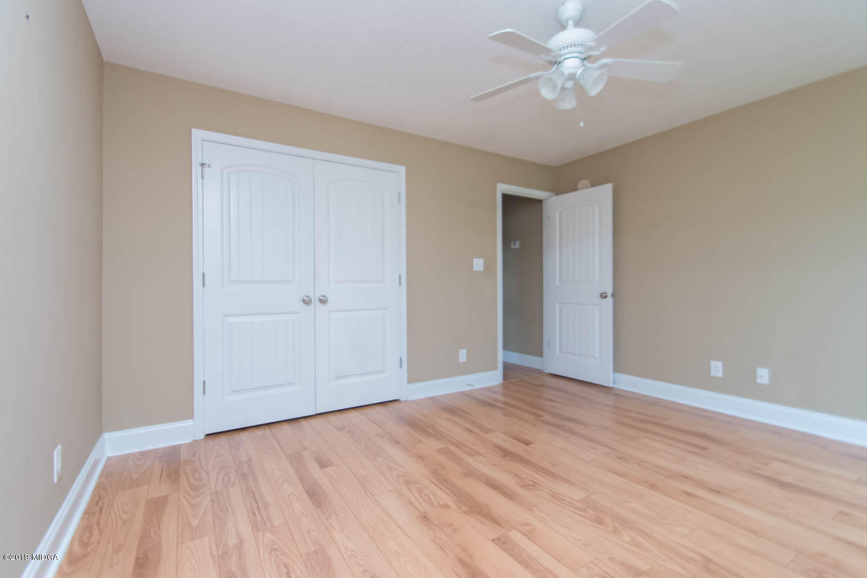 2725 Moseley Road Byron, GA 31008 - Photo 20 of 34 a view of an empty room with a ceiling fan