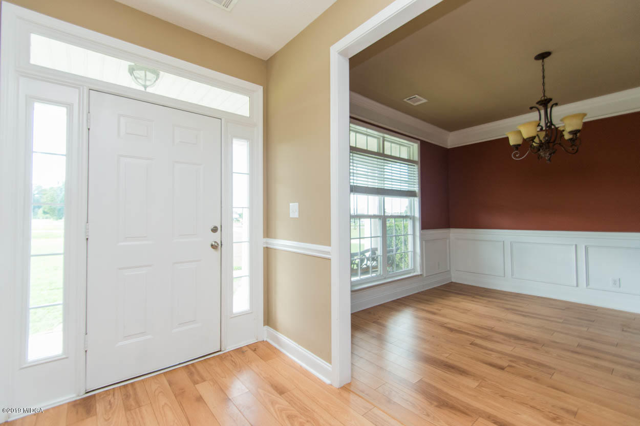 2725 Moseley Road Byron, GA 31008 - Photo 3 of 34 wooden floor in an empty room with a window