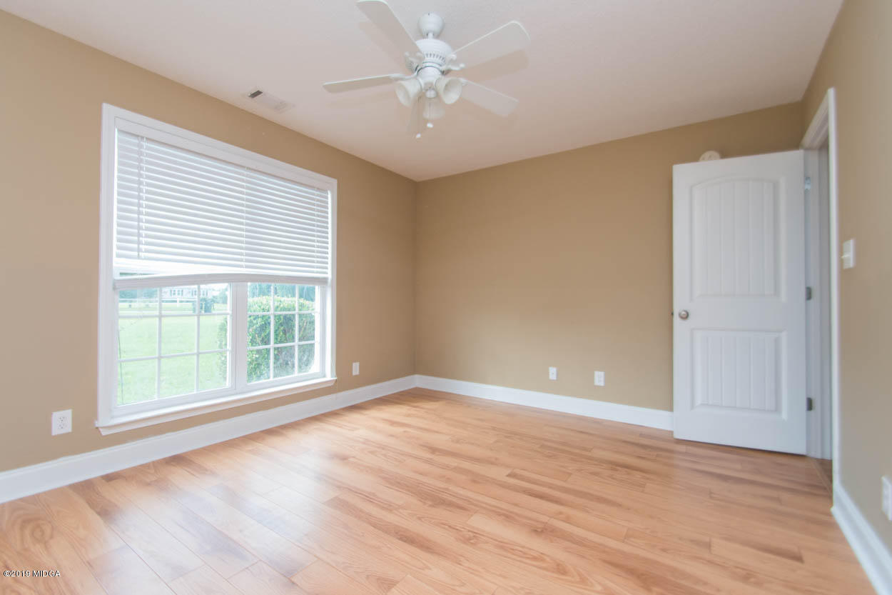 2725 Moseley Road Byron, GA 31008 - Photo 23 of 34 wooden floor in an empty room with a window