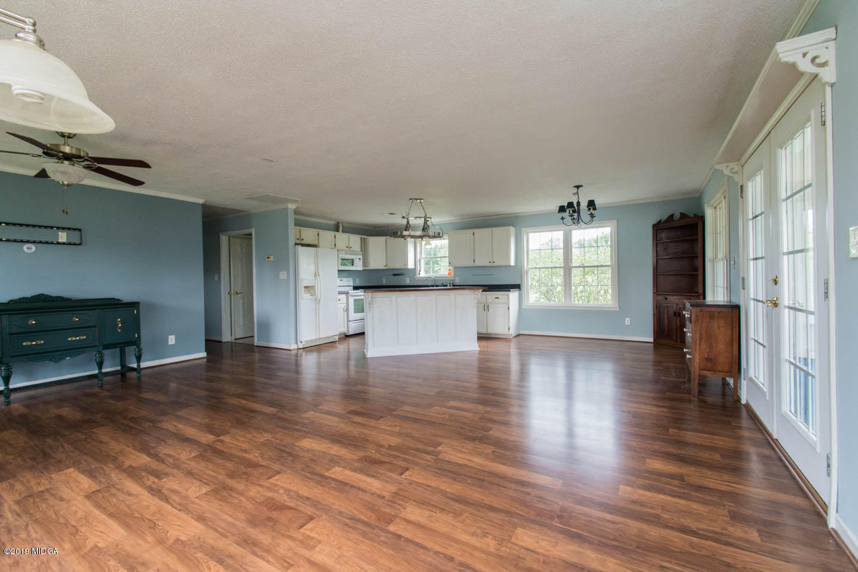 2725 Moseley Road Byron, GA 31008 - Photo 27 of 34 a view of a kitchen with furniture and wooden floor