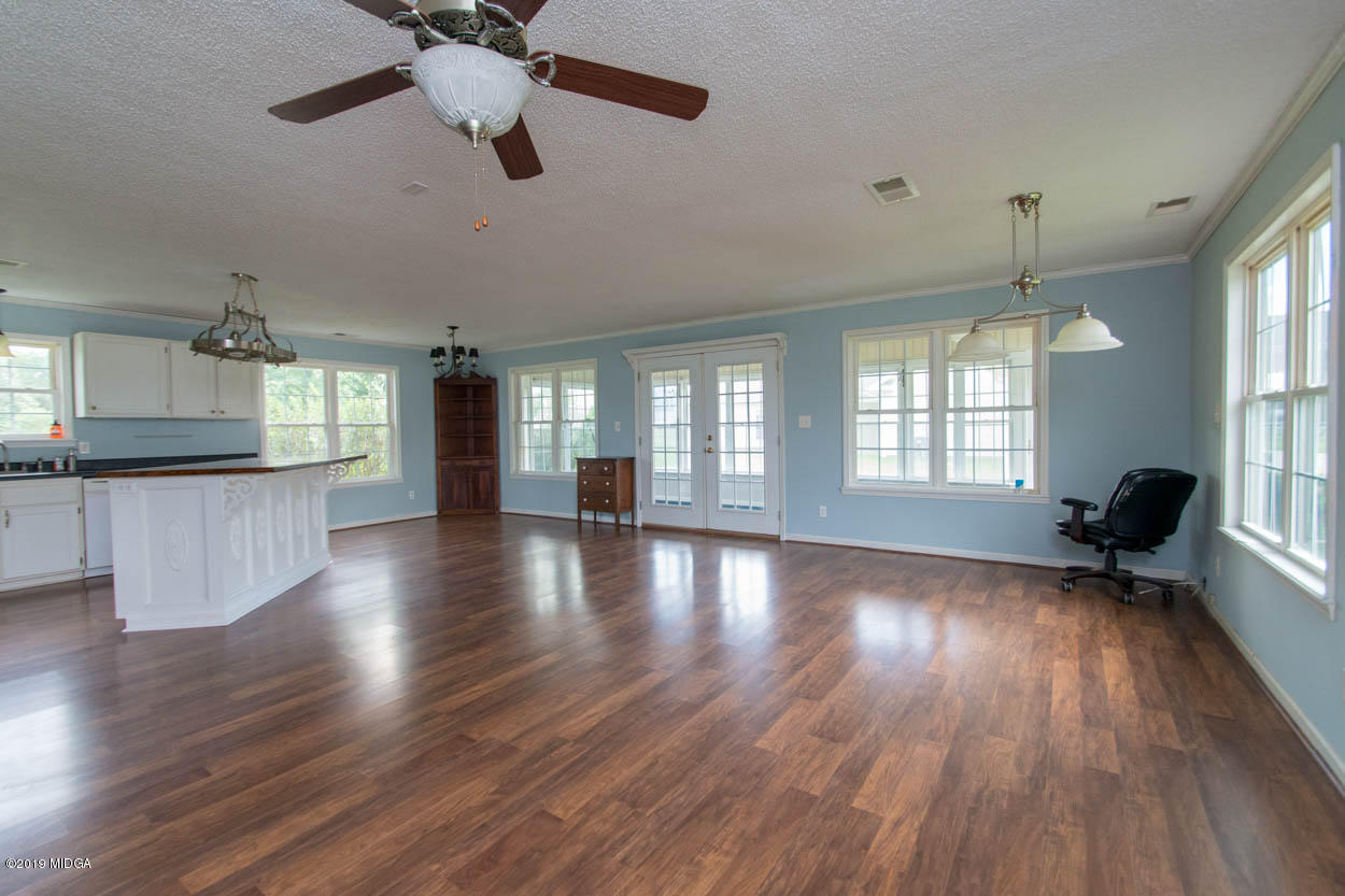 2725 Moseley Road Byron, GA 31008 - Photo 28 of 34 an empty room with wooden floor and windows