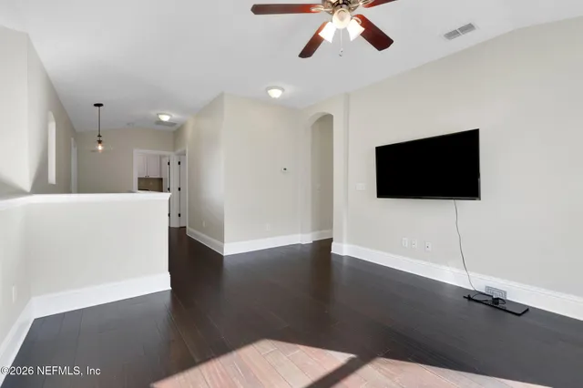 an aerial view of residential houses with outdoor space and street view