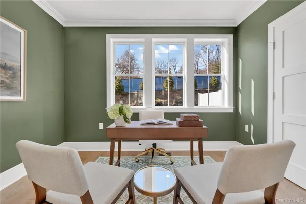 a dining room with furniture and window