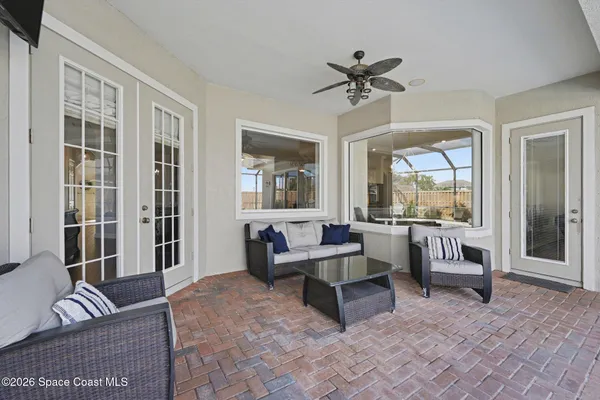 a living room with furniture and a large window