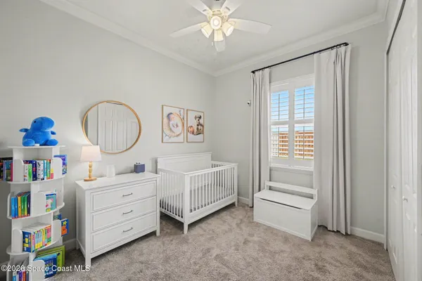 a room that has a bed and a dresser in it