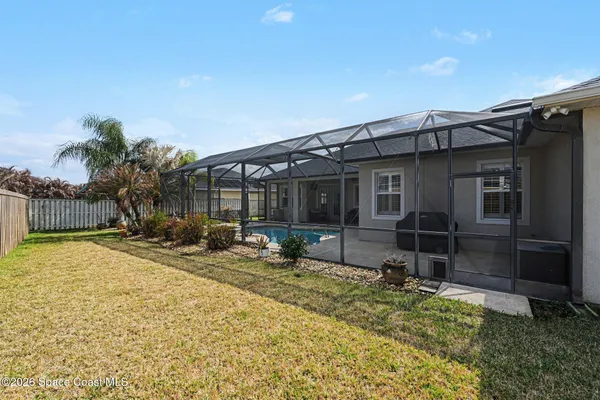 a backyard of a house with seating space