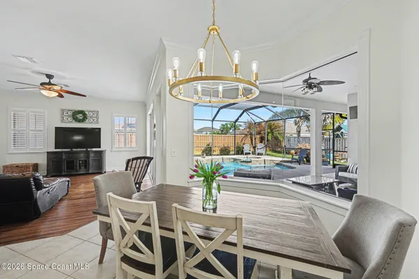 a view of a livingroom with furniture window and wooden floor