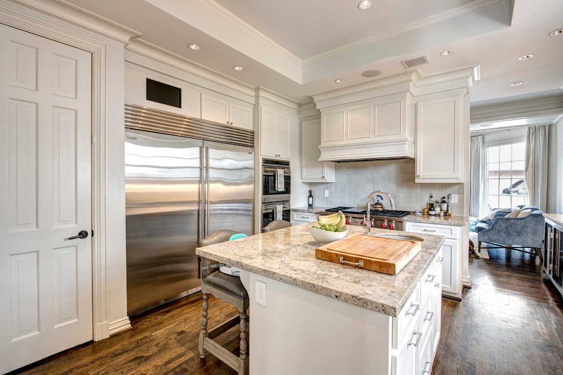 3440 Locke Lane Houston, TX 77027 - Photo 11 of 21 a kitchen with stainless steel appliances granite countertop a sink stove and refrigerator