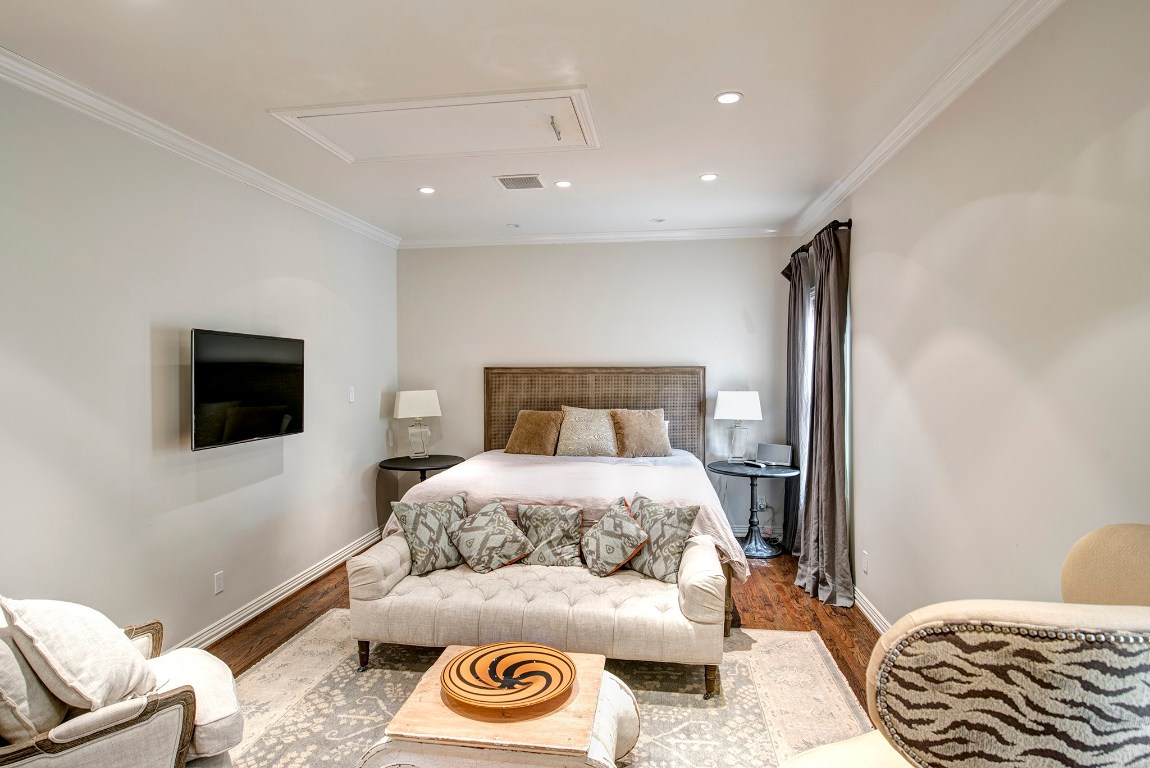 3440 Locke Lane Houston, TX 77027 - Photo 18 of 21 a bedroom with a bed and a television