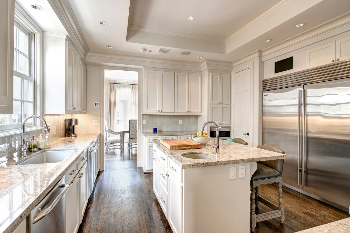 3440 Locke Lane Houston, TX 77027 - Photo 10 of 21 a kitchen with a sink stove and cabinets