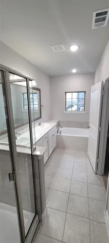 a view of a kitchen with fridge and empty racks