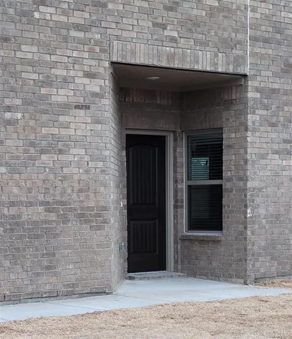 a stone house with a outdoor space