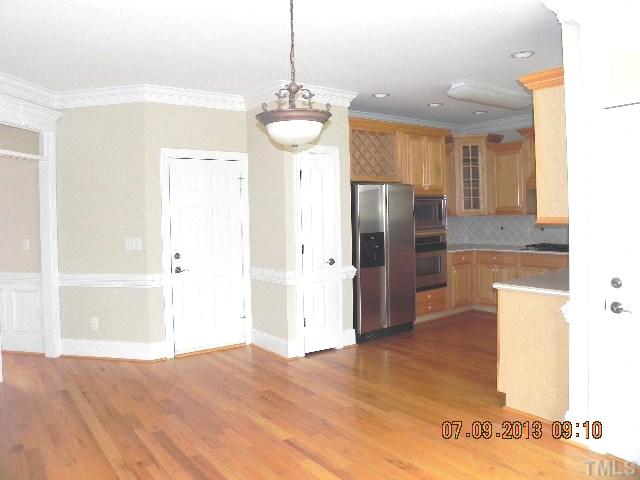 213 Waterville Street Raleigh, NC 27603 - Photo 11 of 24 a view of a kitchen with a refrigerator