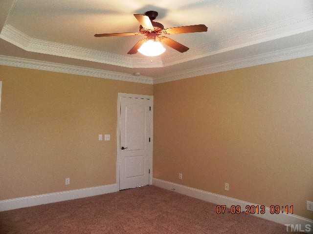 213 Waterville Street Raleigh, NC 27603 - Photo 12 of 24 an empty room with a ceiling fan and a window