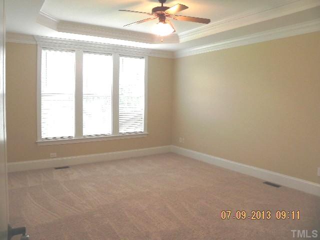 213 Waterville Street Raleigh, NC 27603 - Photo 13 of 24 an empty room with a window and a fan