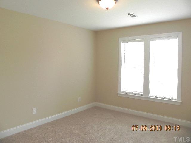 213 Waterville Street Raleigh, NC 27603 - Photo 17 of 24 an empty room with a window