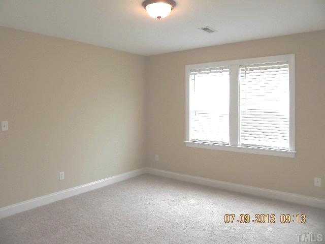 213 Waterville Street Raleigh, NC 27603 - Photo 18 of 24 an empty room with a window