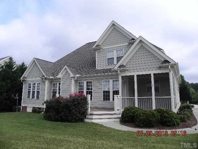 213 Waterville Street Raleigh, NC 27603 - Photo 22 of 24 a view of a front of house with a yard