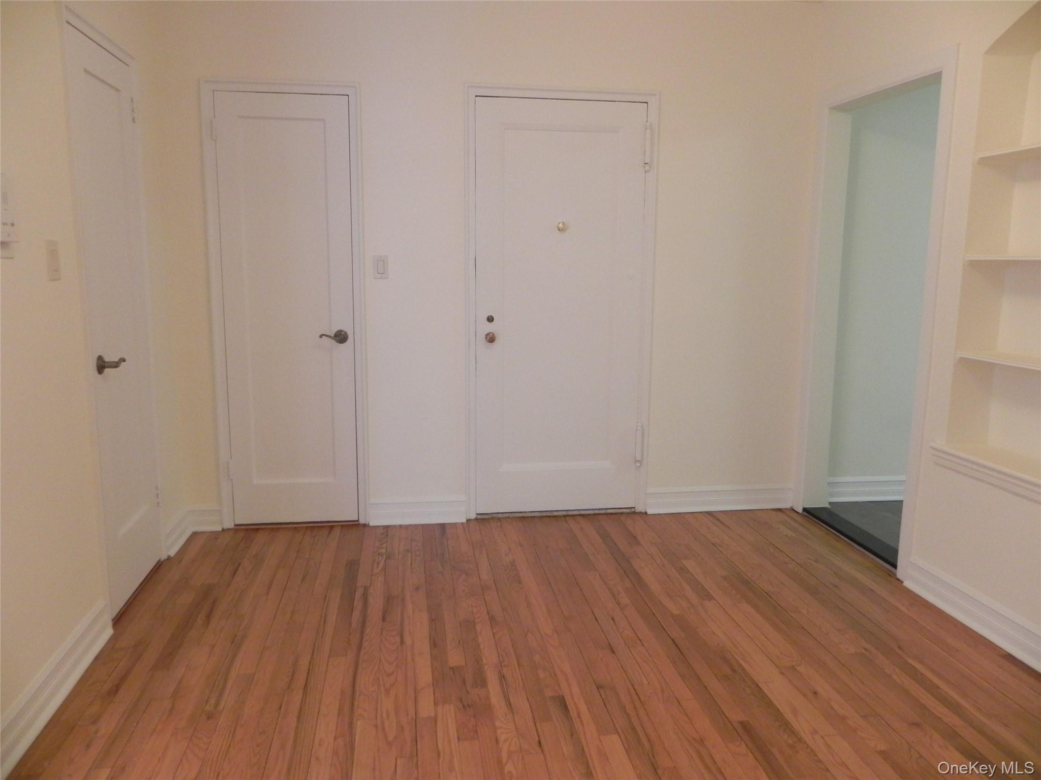 160 South Middle Neck Road, Unit 1N Great Neck, NY 11021 - Photo 3 of 15 Entry with built in shelves and hardwood flooring