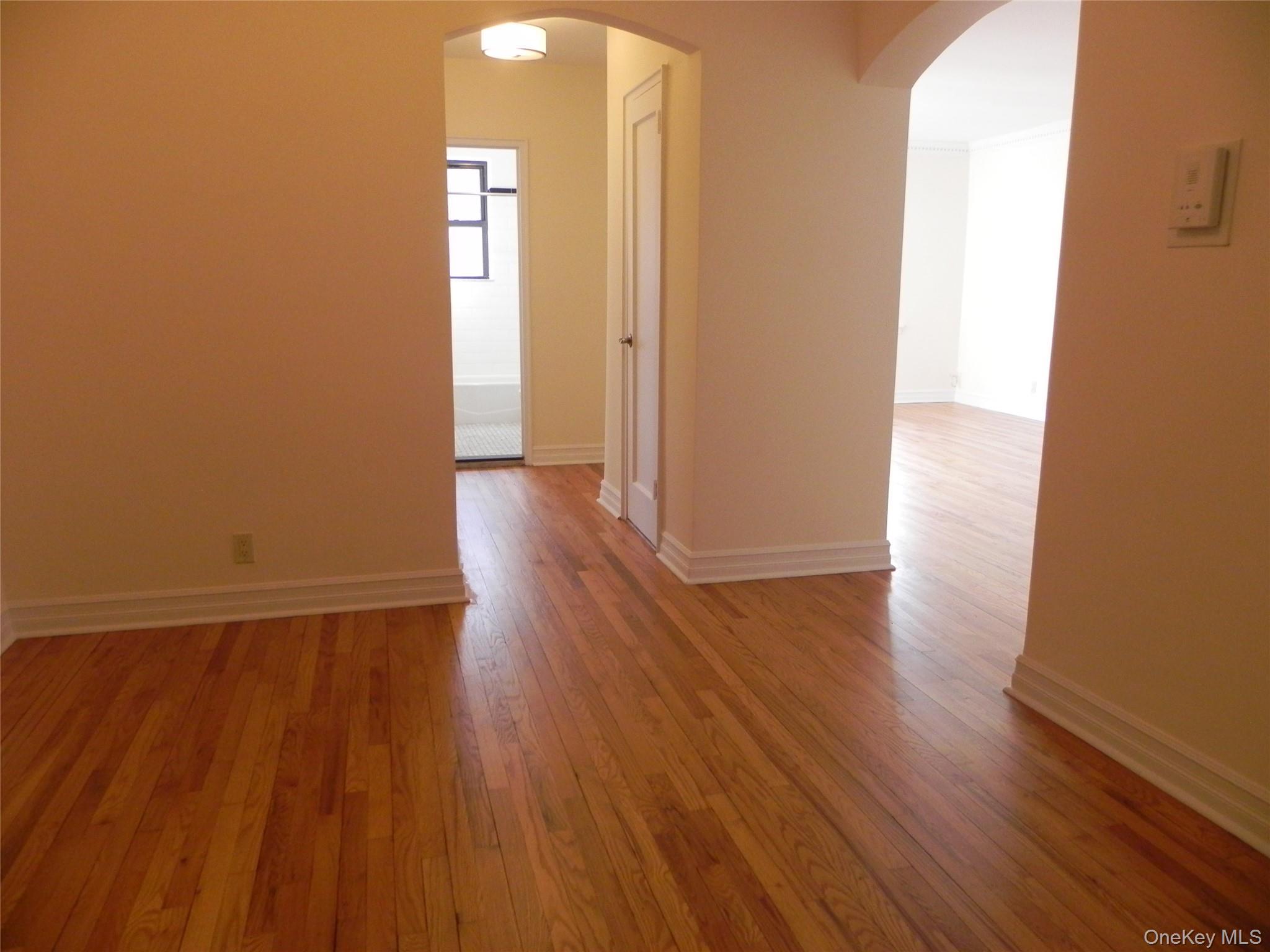 160 South Middle Neck Road, Unit 1N Great Neck, NY 11021 - Photo 5 of 15 Entry with hardwood floors throughout