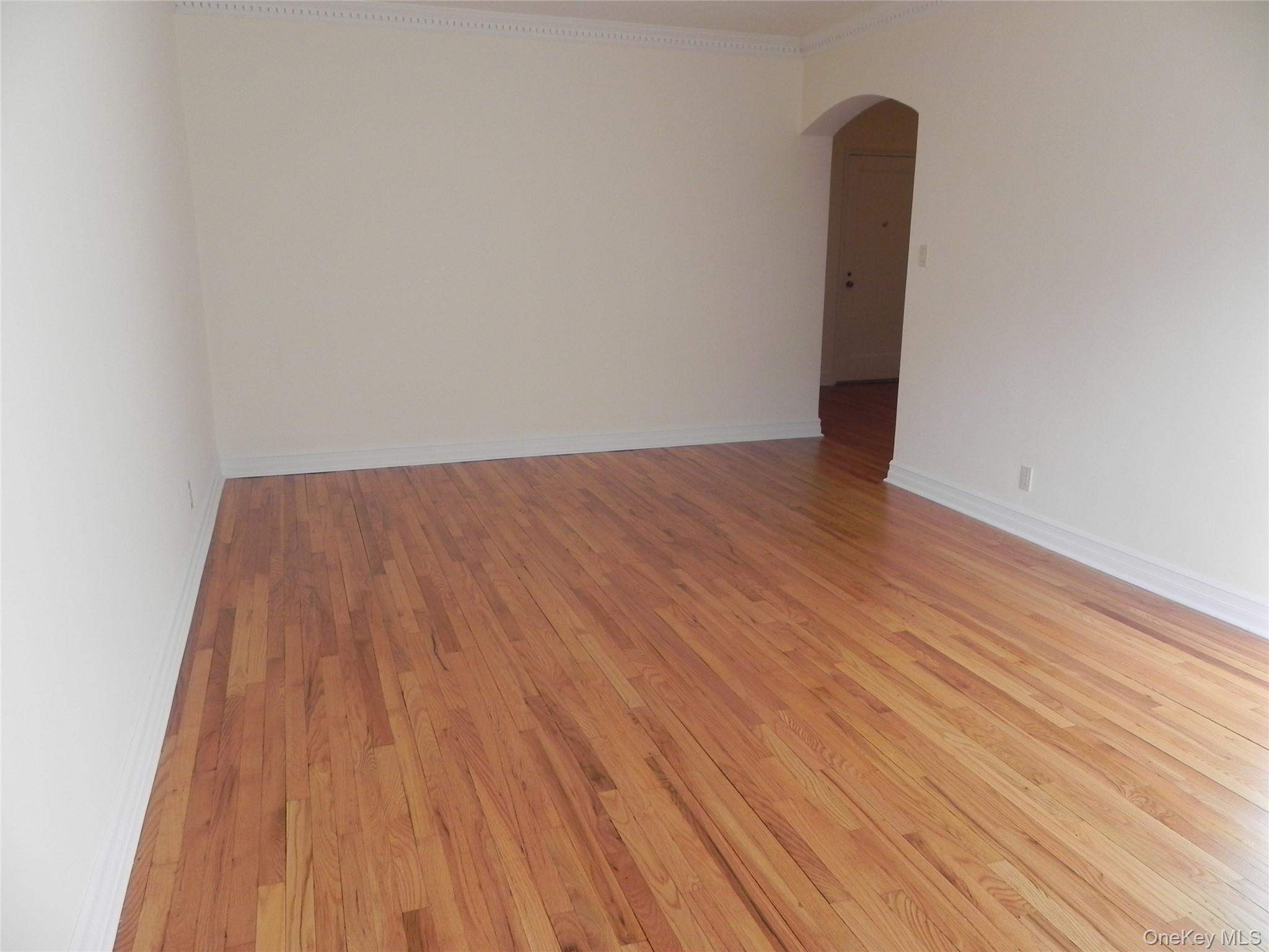 160 South Middle Neck Road, Unit 1N Great Neck, NY 11021 - Photo 6 of 15 Living room with crown molding and hardwood flooring
