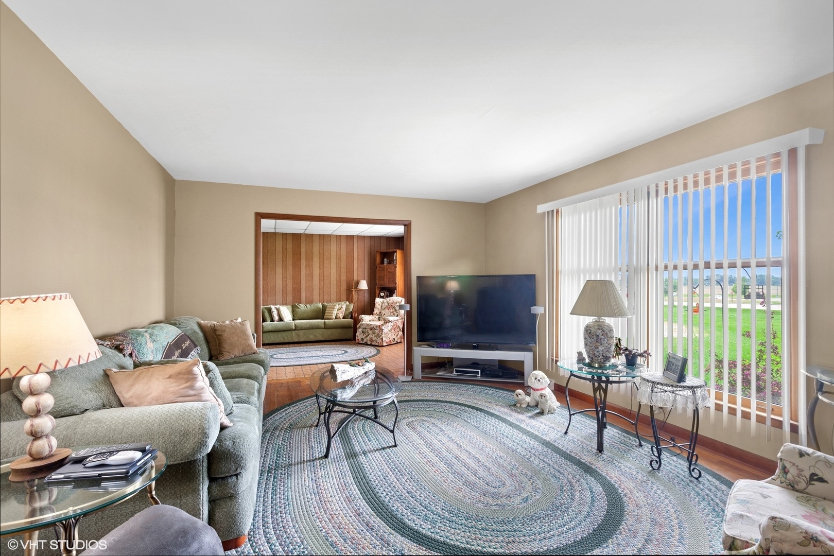 43W888 Hughes Road Elburn, IL 60119 - Photo 5 of 25 a living room with furniture a window and a flat screen tv