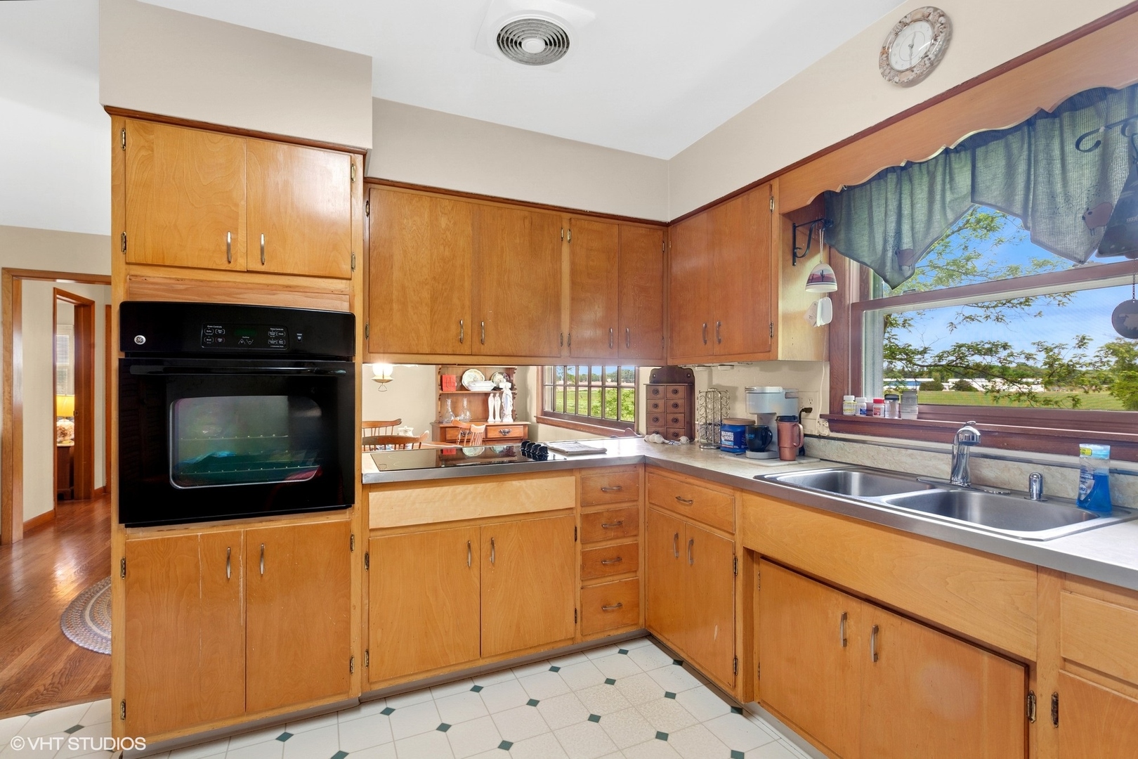 43W888 Hughes Road Elburn, IL 60119 - Photo 7 of 25 a kitchen with a sink stove and microwave