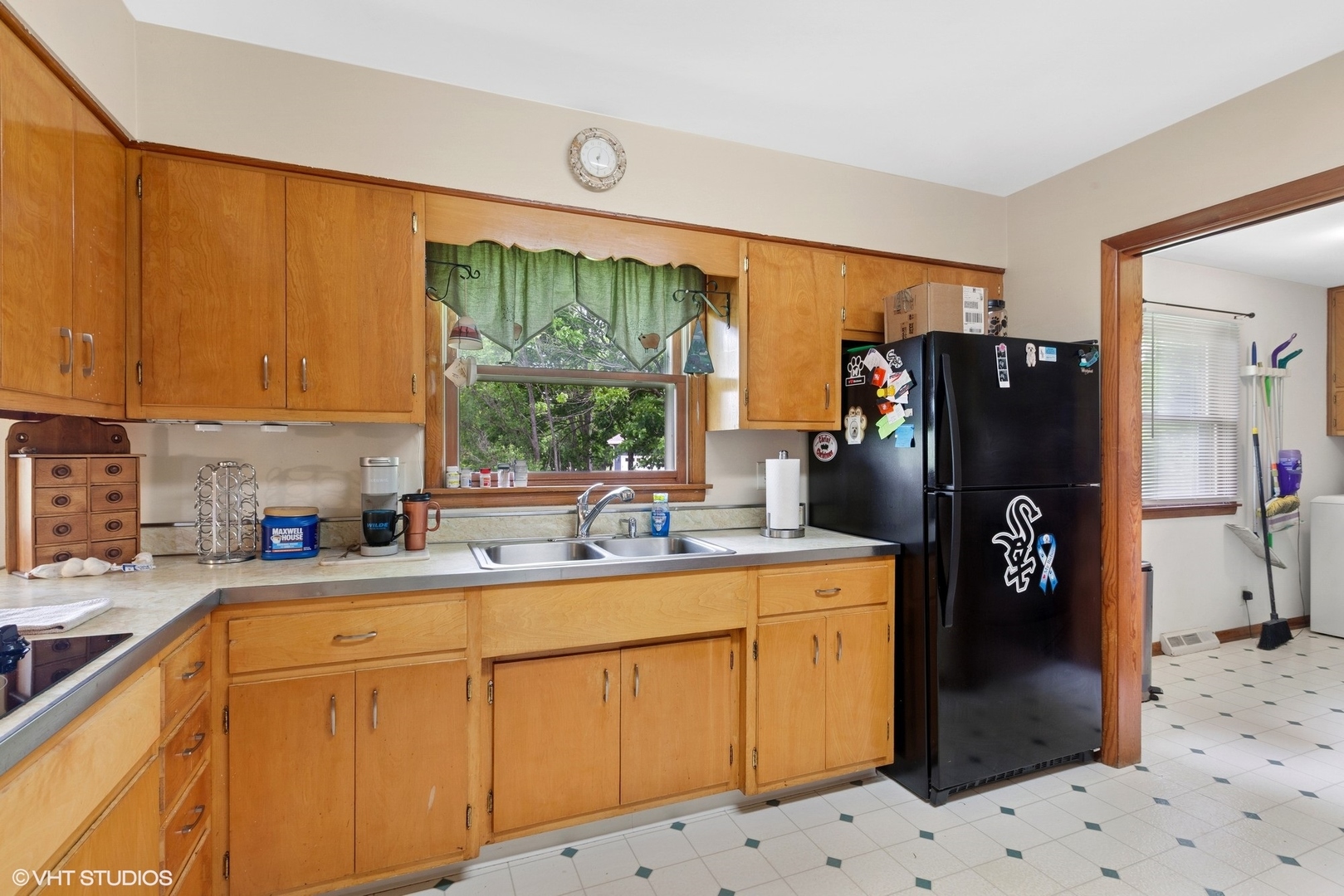 43W888 Hughes Road Elburn, IL 60119 - Photo 8 of 25 a kitchen with a sink refrigerator and cabinets