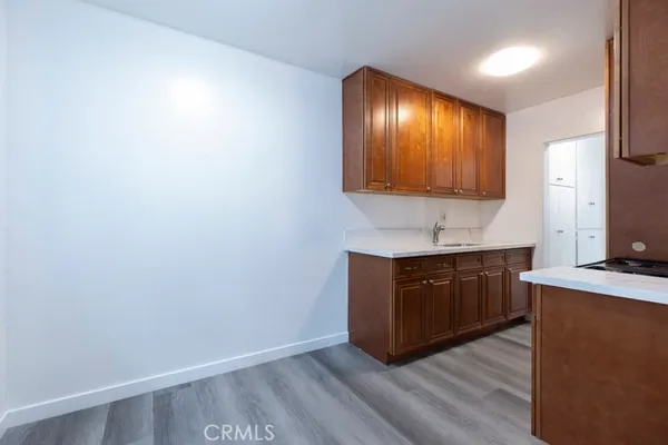 a view of kitchen with wooden floor